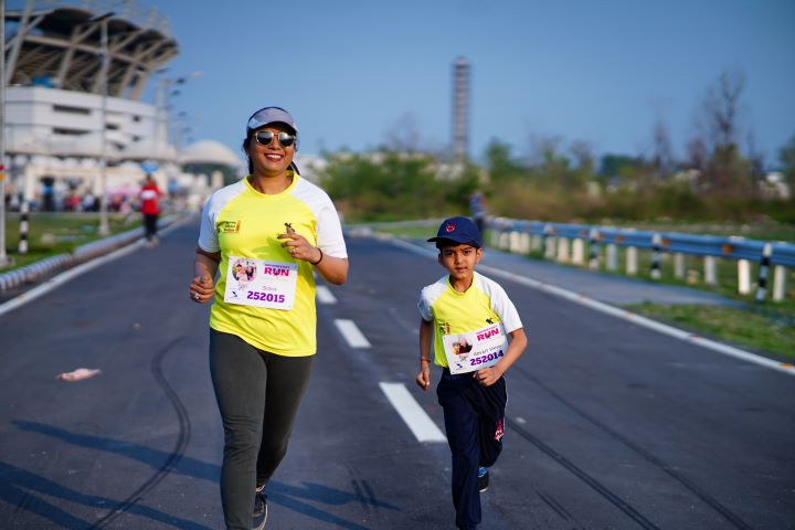 Mother and child running together